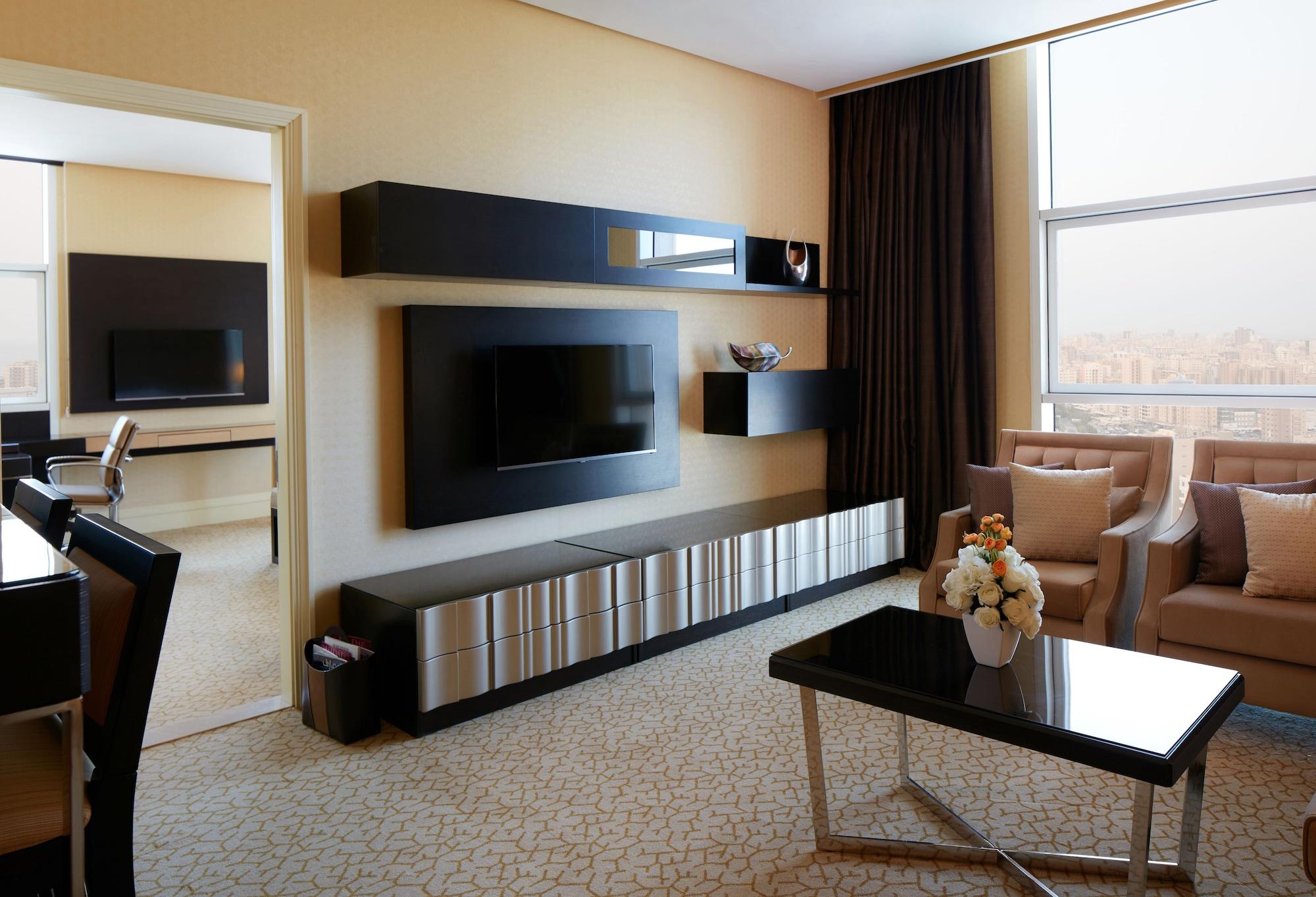 Millennium Hotel & Convention Centre Kuwait Kuwait City Exterior photo A living room with a television